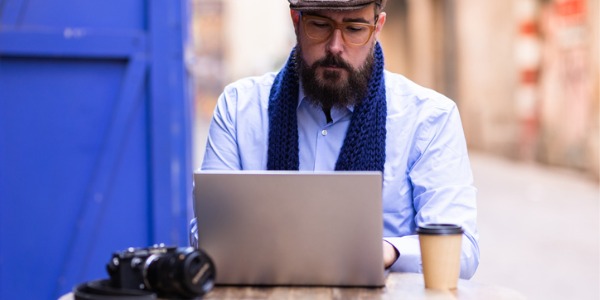 A photojournalist working on his computer.