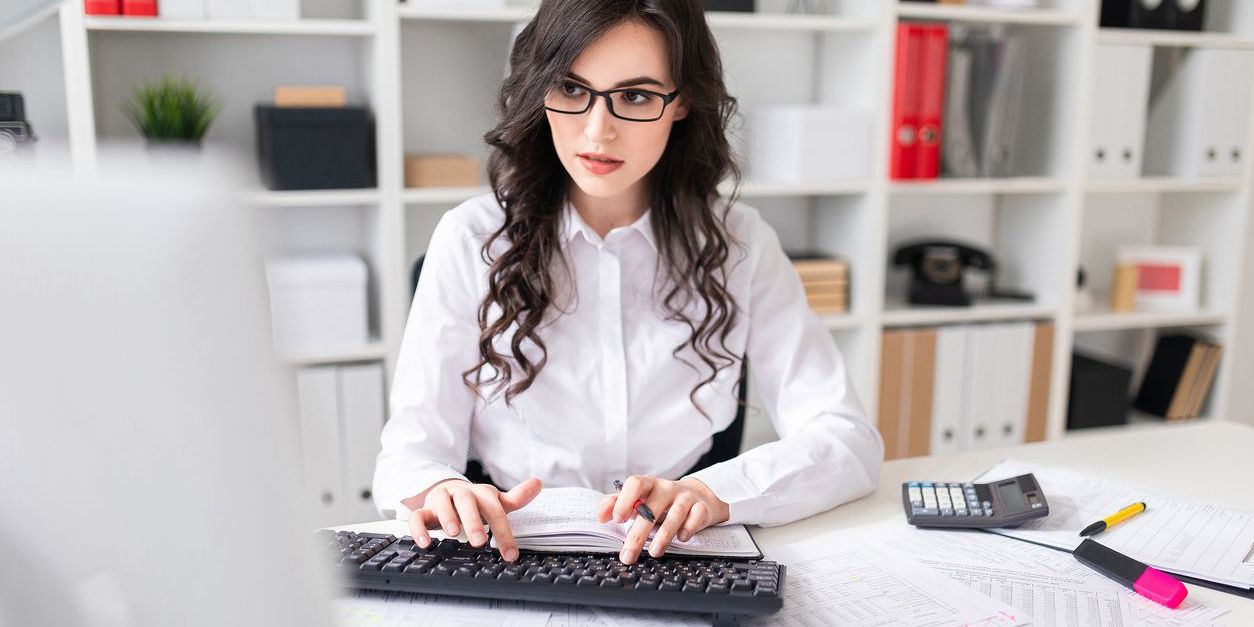 A data entry clerk working at her desk.