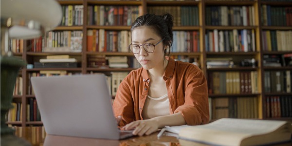 An archivist working on her computer.