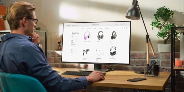 An online merchant working on product listings on a website.