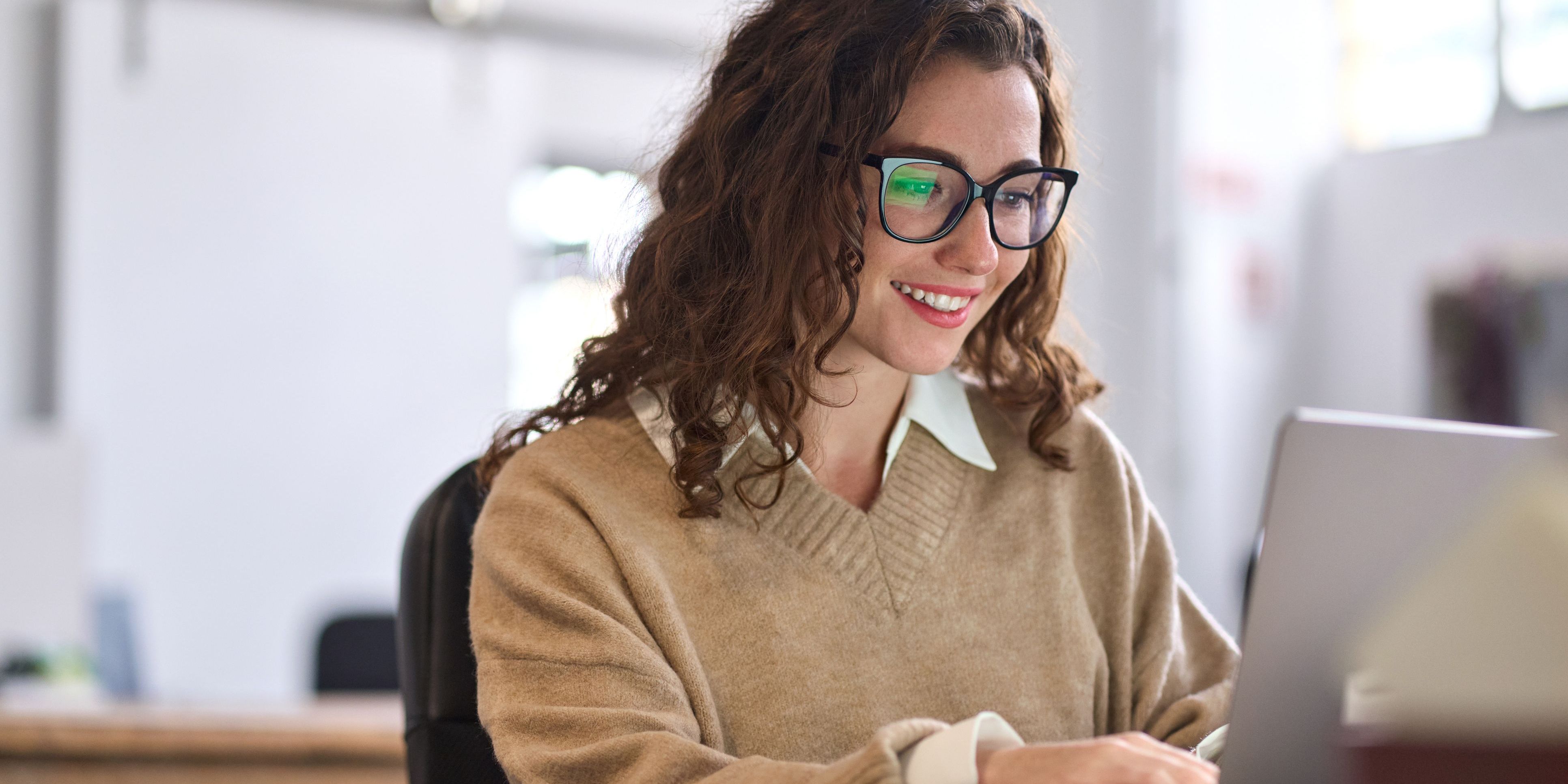A marketing specialist working on her computer.