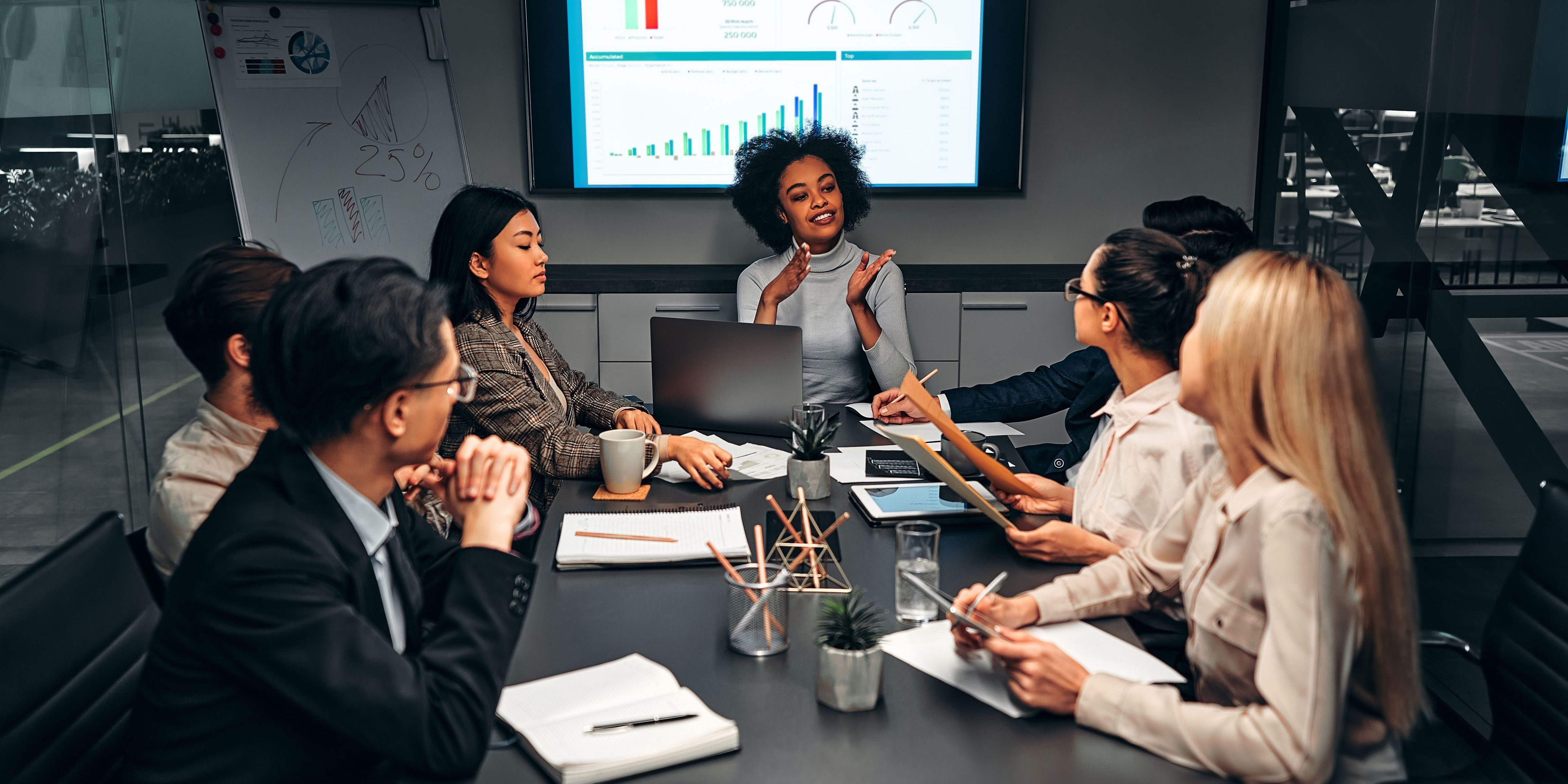 A policy analyst proposing policy solutions at a meeting.