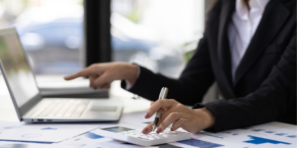 A risk management specialist sitting at her desk and working.